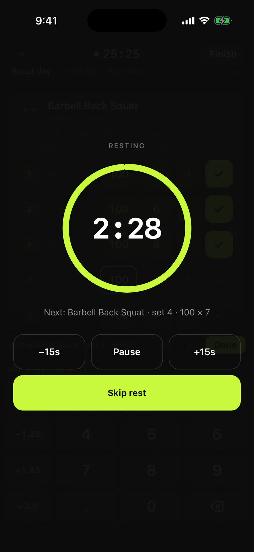 The full-screen rest timer: a lime ring counting down from 2:28, labelled Resting, with the next set named underneath as Barbell Back Squat set 4 at 100 kg for 7 reps, and controls for minus fifteen seconds, pause, plus fifteen seconds and skip rest.